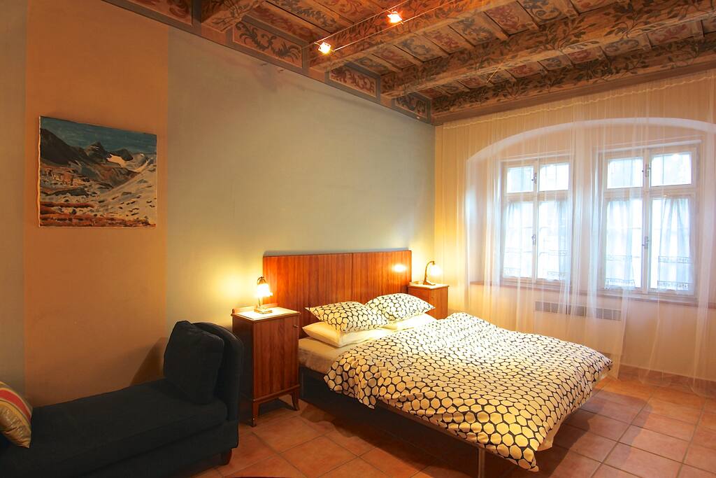 First bedroom with a double bed and original painted ceilings