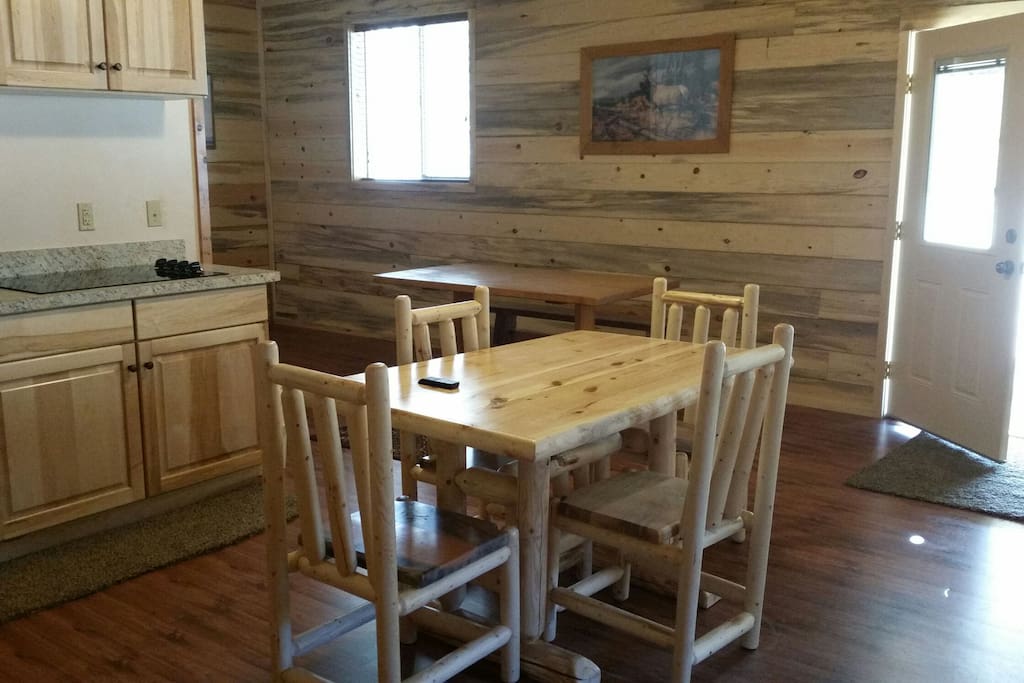 Well stocked cupboards-dining table with 4 chairs