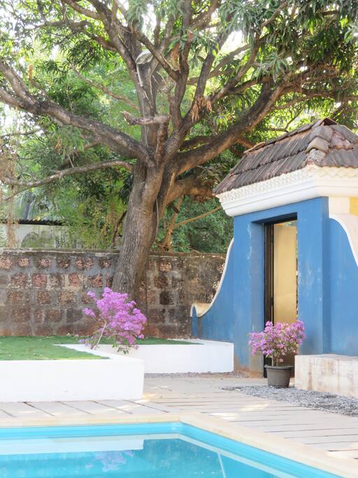 A traditional Portuguese gateway leads to the enclosed private garden and pool