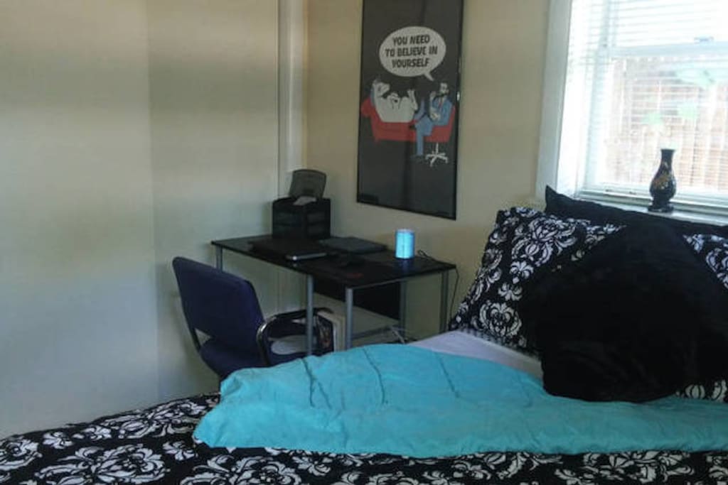 This is another view of the spacious bedroom (gotta find another word for 'not cramped'). The desk is large enough for you to comfortably work and have your laptop and other electronics on the desk!