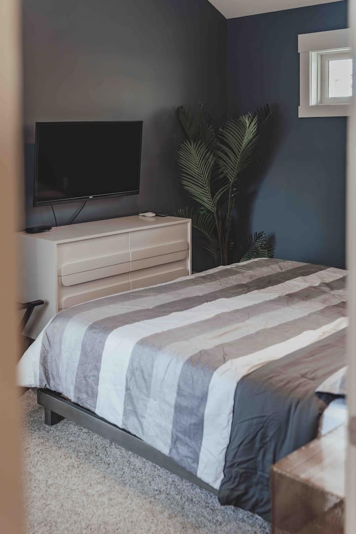 1 of 2 bedrooms on the upper level with super cozy King bed, satellite TV.