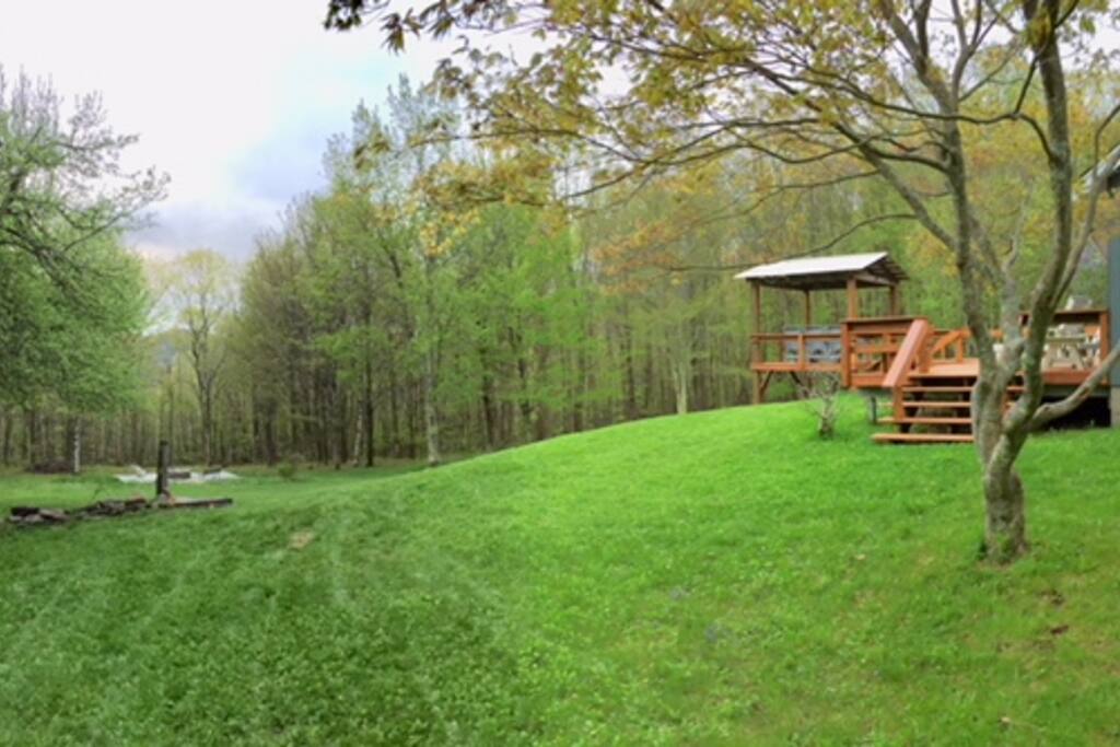 View of yard and side of deck and eating area