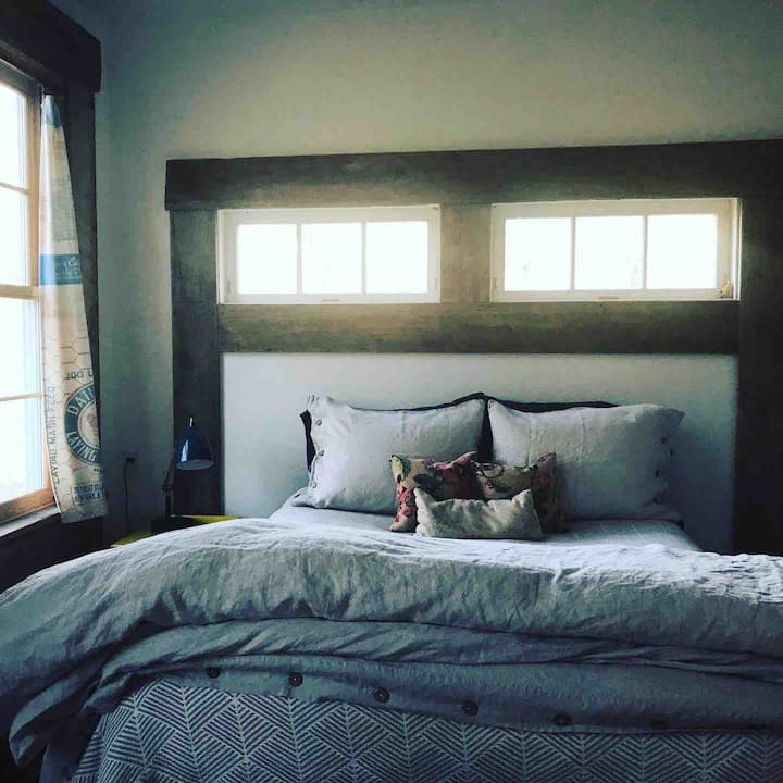 The master bedroom has an adjacent bathroom, and 100% European OKOtex certified linen sheets. And plenty of feather pillows. It’s delicious! 