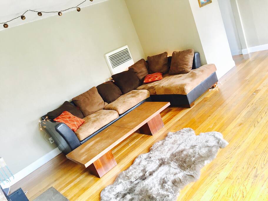 What's a home without an obnoxiously soft rug in the chill space? (Also? Those string light look heck'in classy in the evenings.)