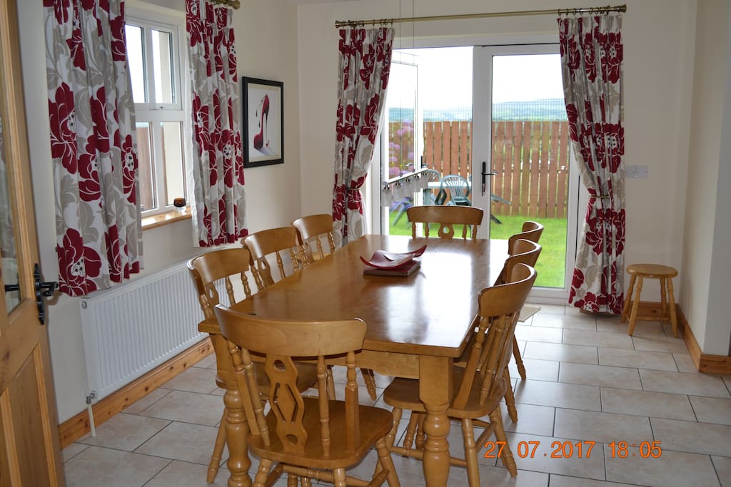 Dining area (seats 8) with patio doors to fenced off rear garden