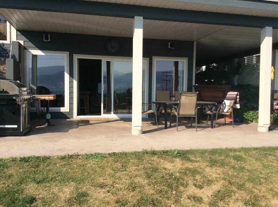Your own private covered deck complete with propane BBQ, seating and dining area, loungers, and an electric fireplace for evening ambiance!