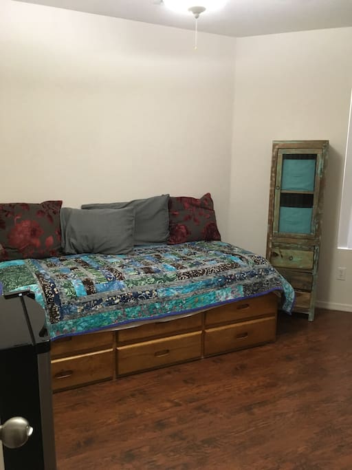 Standard twin size bed with storage underneath