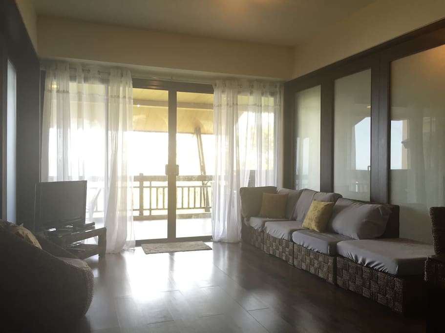 Spacious living area that opens up to a wide balcony