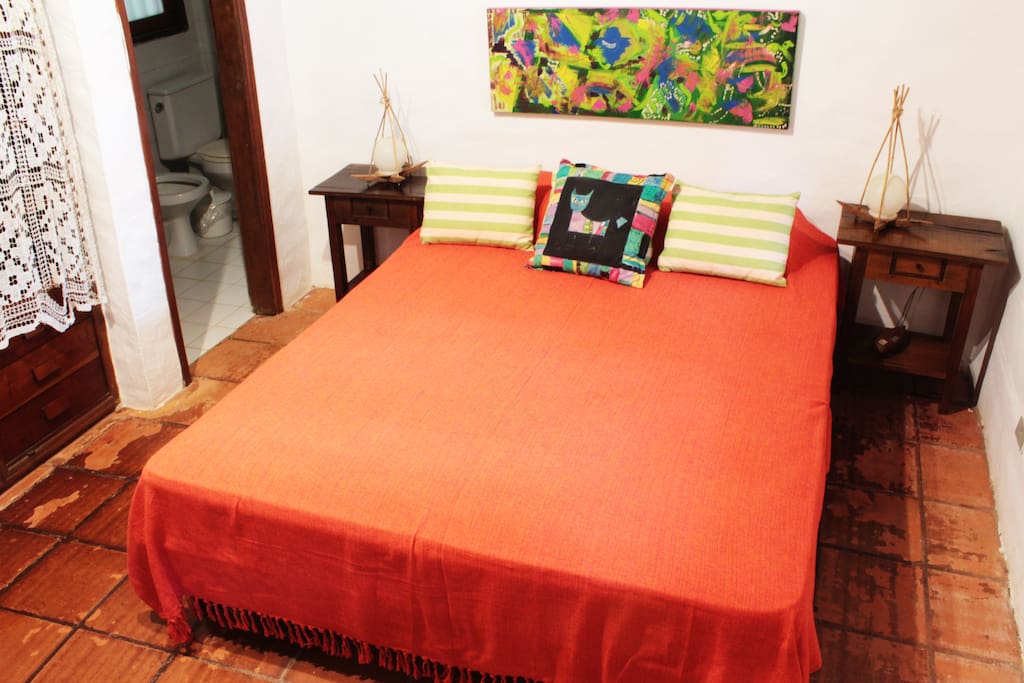 Cama de casal da Suite Hibisco
