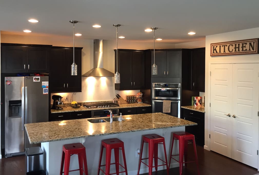 Kitchen with two ovens, microwave and gas range stove