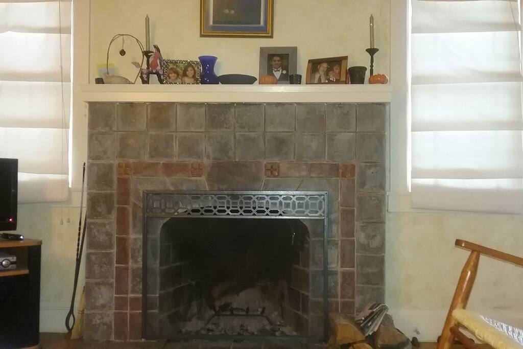 Wood burning fireplace in living room.