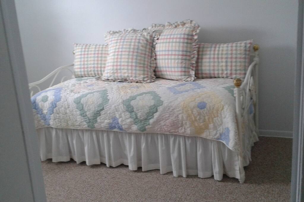 Large bedroom with front window