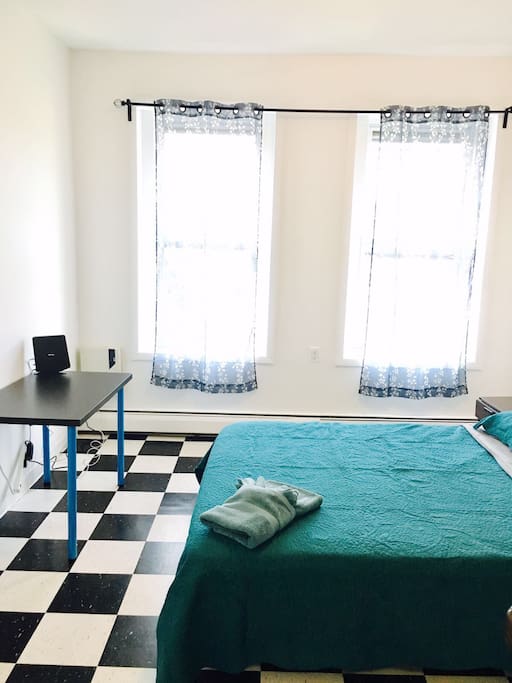 Queen size Bed with a new Therapeutic Mattress. Computer table in the room as well