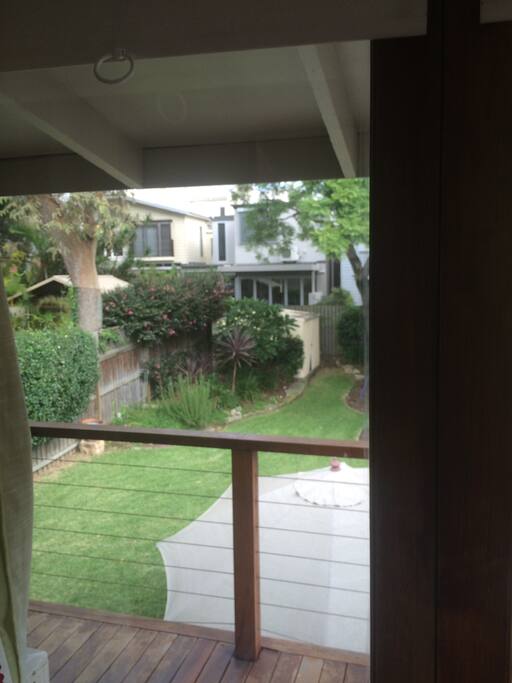 Large garden with kids play area including trampoline - view from upstairs balcony