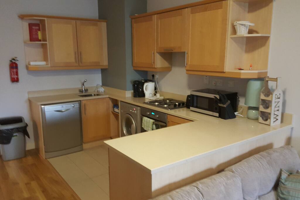 Modern kitchen with microwave, dishwasher and coffee machine