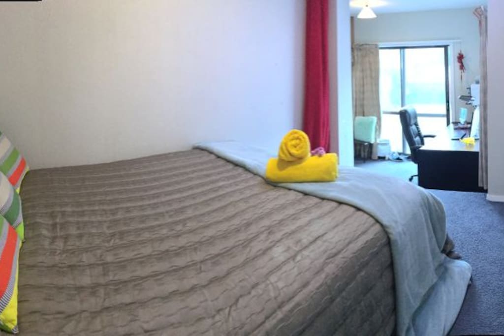 large bed room with queen size bed and has nice garden view. Large sliding door access to private garden.