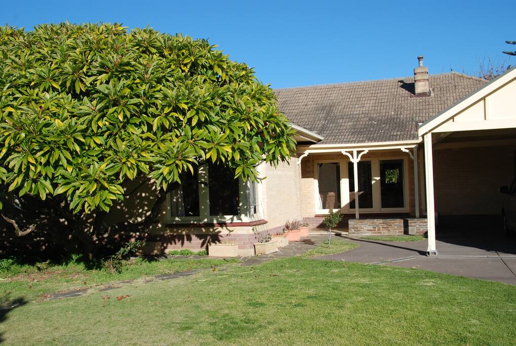The front of the house has a carport for 2 cars