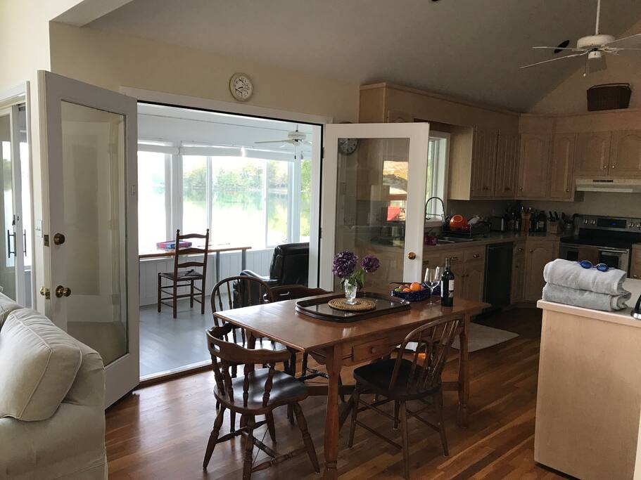 You can open doors behind dining room table for access to the sun room