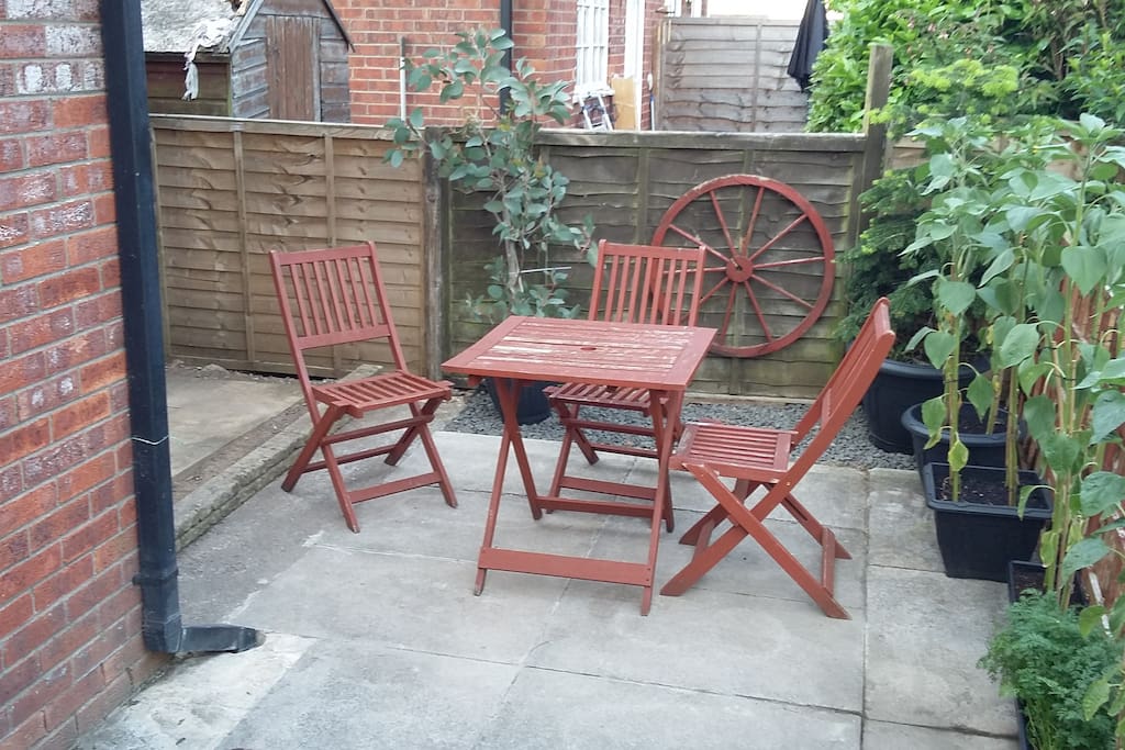 Enclosed rear garden with seating area