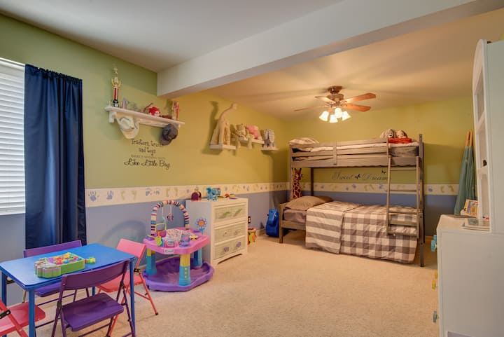 Bunk bed with plenty of toys for the kids.