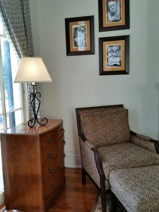 Jazz-themed Living Room with original floors and 12 foot ceilings.