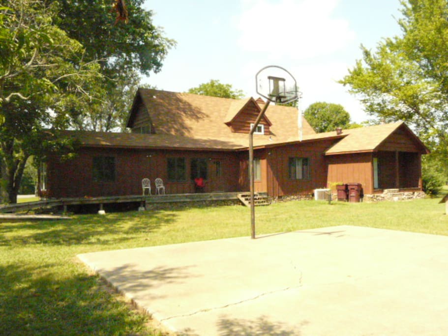 Basketball court. Deck. Also has a garden/farm in backyard with chickens, goats, rabbits.