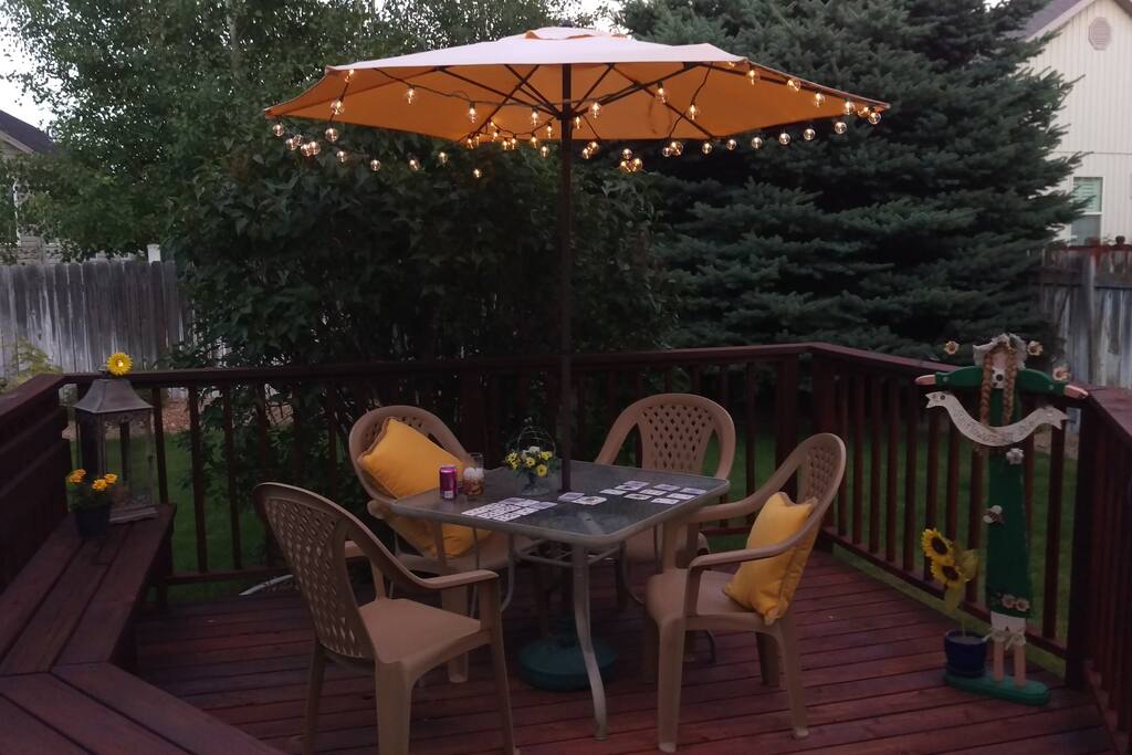 Relax on the deck in our peaceful backyard