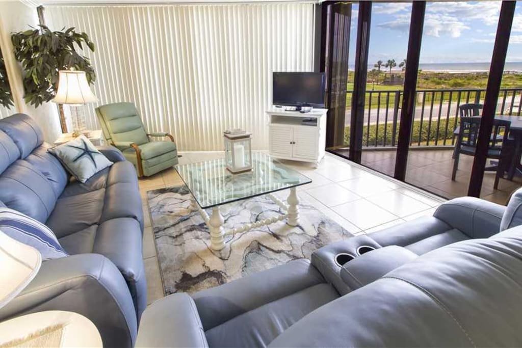Family Room with a View - Enjoy sitting on the couch and playing a game of cards or watching the breeze float through the palm tr
