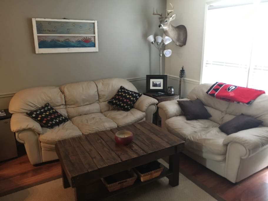 Living room: Leather Couch, Love Seat and Chair.