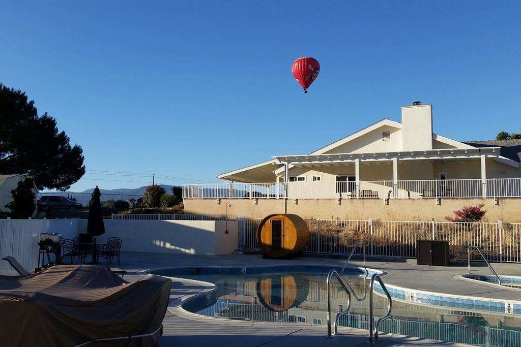 You can see hot air balloons flying by in the morning.