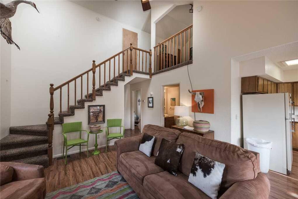 Family Room with a View - Enjoy sitting by the fireplace, playing a game of cards, and watching the snow fall outside the windows