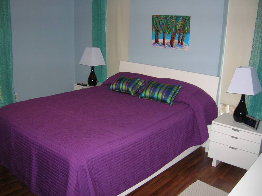 Queen bed with private bathroom.