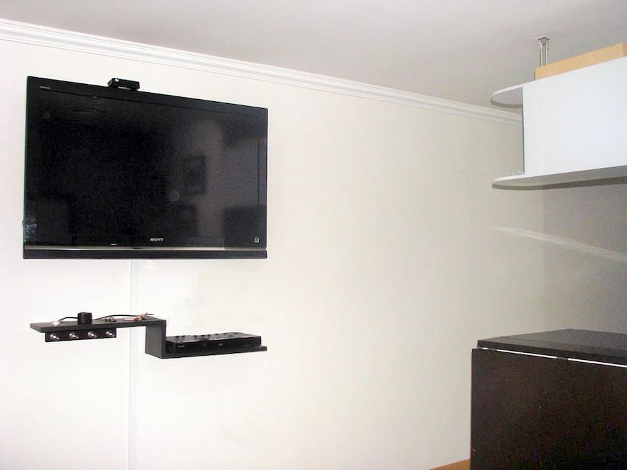 a 46" TV an a DVR on the living/sociual area