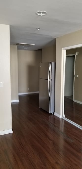 Full size Refrigerator next to large clauset