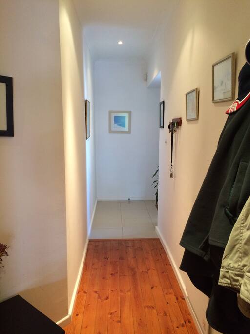 Hallway facing front door that’s on the right