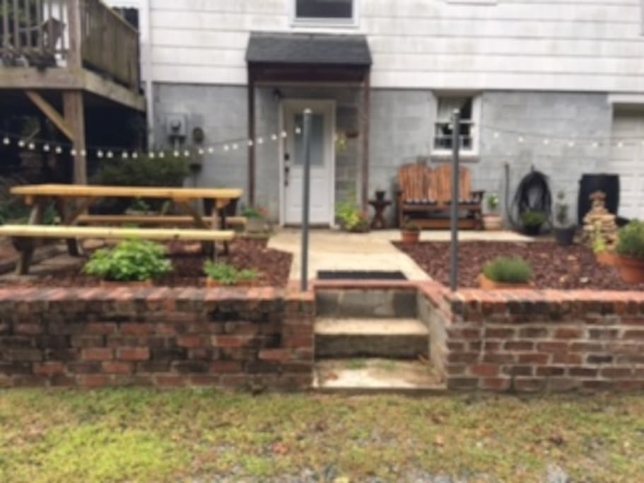 Outdoor space with fresh herbs to cut, picnic table and your own private entrance.