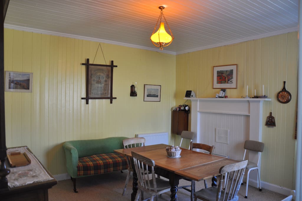 Dining room. This is the table extended. It can be made smaller. Extended it will comfortably seat 8. There are 8 chairs.