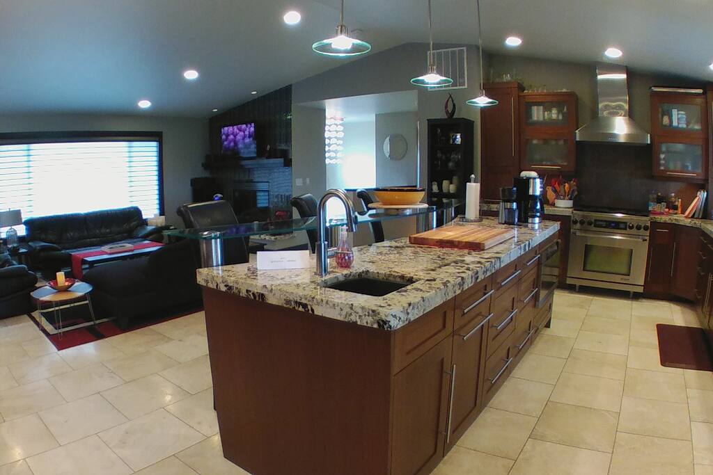 Gourmet kitchen with glass bar above island