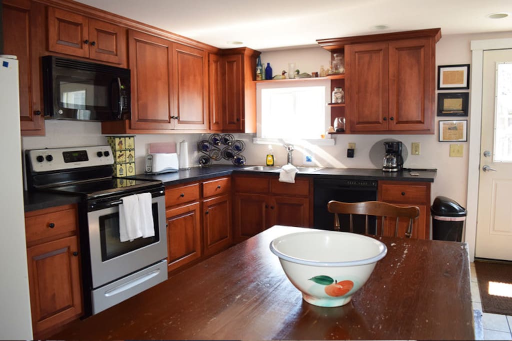 Fully equipped kitchen with two separate refrigerators.