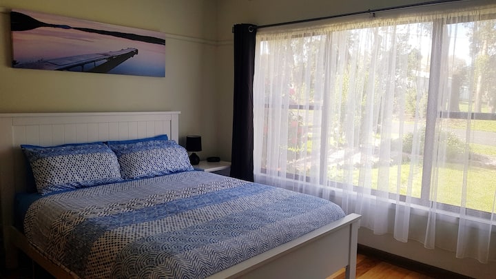 Main bedroom, with electric blankets on the bed, and television
