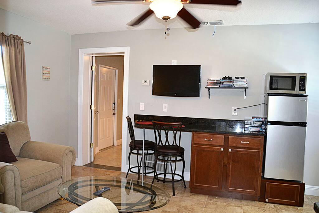 Kitchen/Living area looking towards entry room/laundry room.