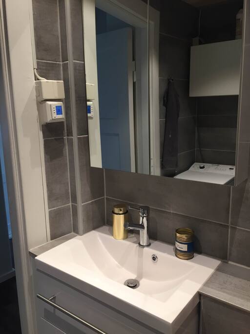 Brand new bathroom with washing machine and heating.
