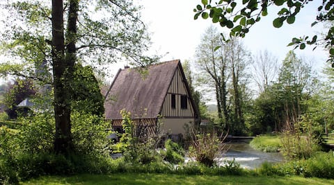 Authentic old river mill in Normandy countryside