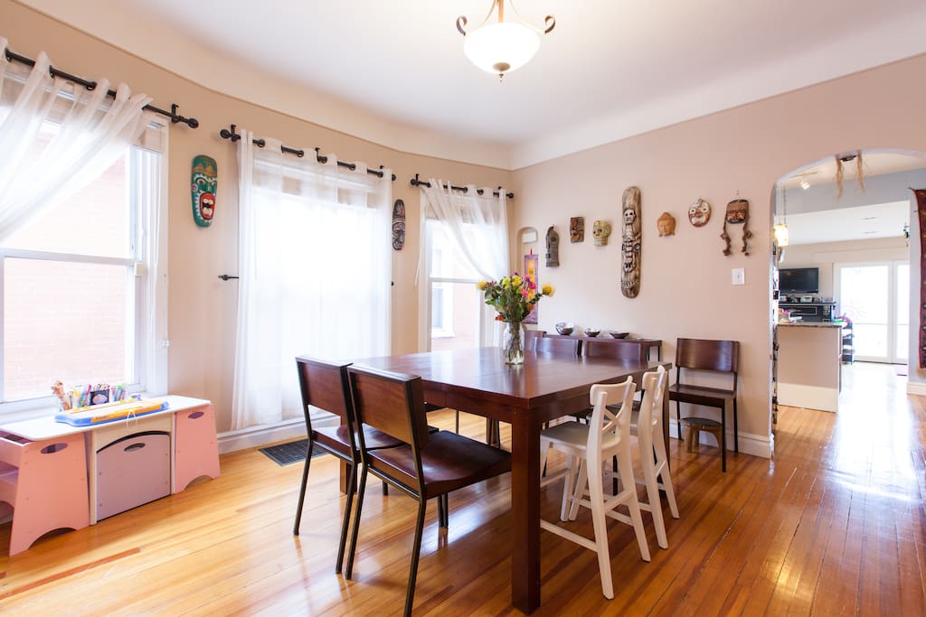 Dining room table with seating for eight, and a kids art table