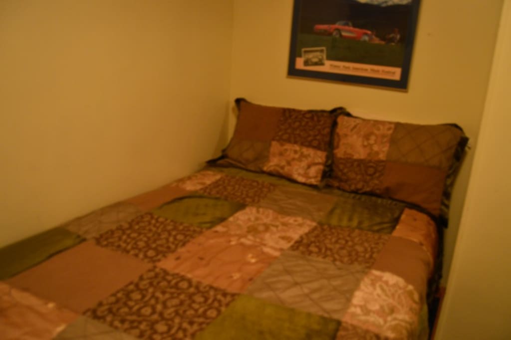 This is a small hotel room with a full size bed. There is a color TV and a Private Bath. There is a small window but no view. The room is warm and clean, there a quite a few steps to get to it though.