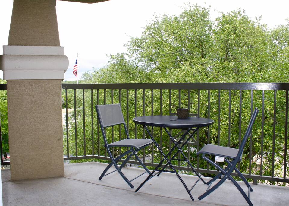 Balcony with seating for two.