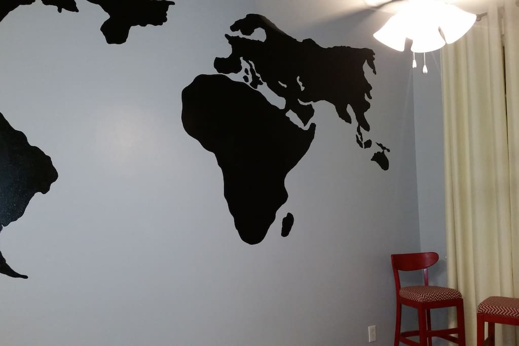 Personalized wall mural welcoming visitors from around the world.