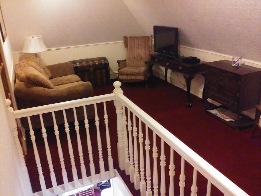 Upstairs living room with mini fridge and microwave.