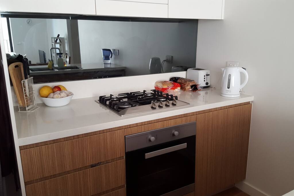 Fully equipped kitchen with gas burner and oven
