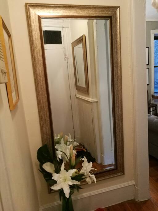 A welcoming separate hallway with full length mirror!